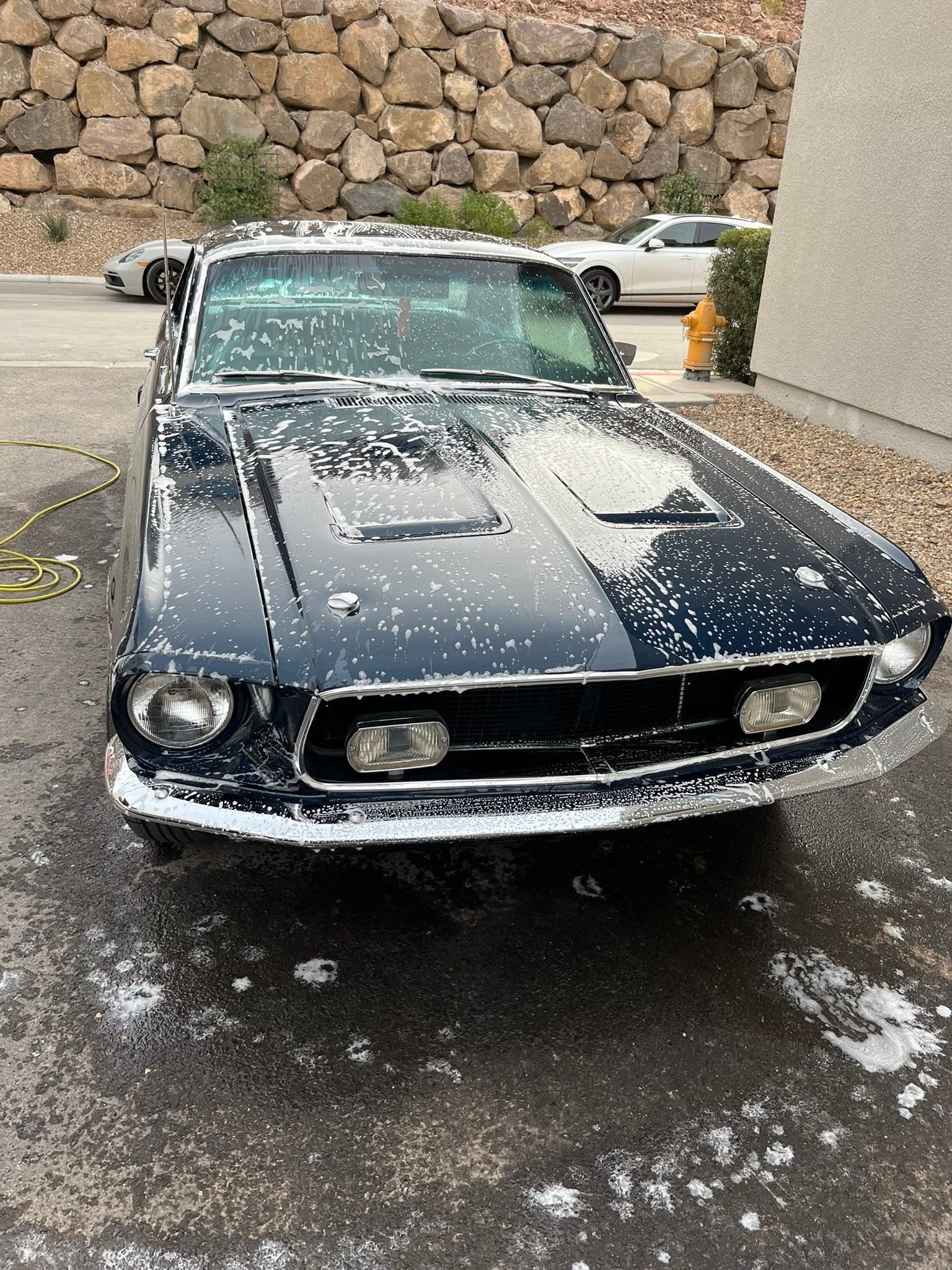 Classic Mustang during a foam wash