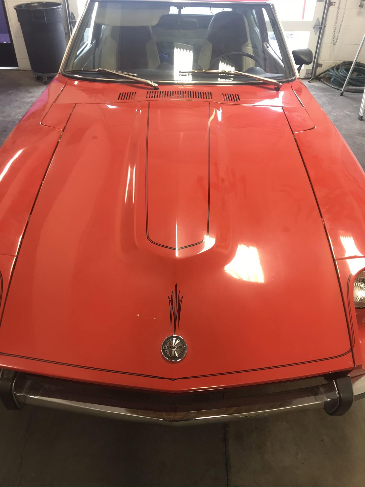 Polished red classic car hood