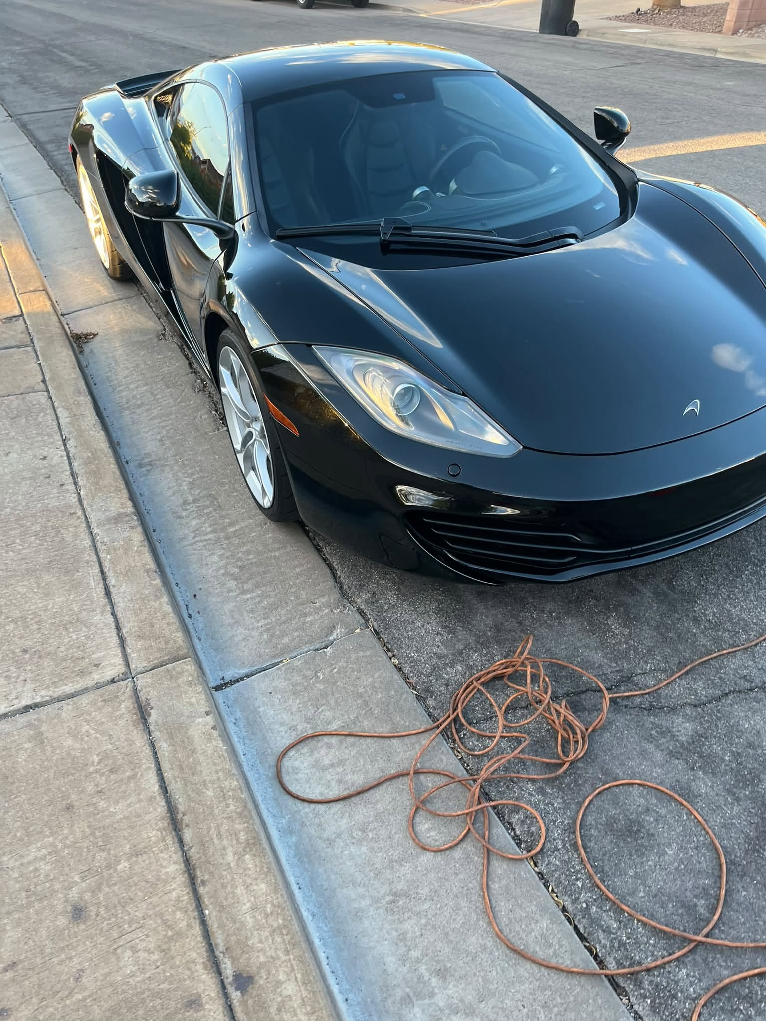 Black luxury sports car professionally detailed by Cosmetic Auto Detail